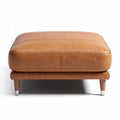 Leather upholstered ottoman with wooden legs 75 x 75 x 40cm in tan color